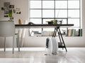 De'Longhi Nano 500W Oil-Filled Radiator - White - next to a desk in a home office