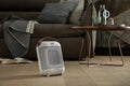 De'Longhi Capsule 1800W Fan Heater - White - in a living room