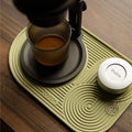 Outin Silicone Coffee Mat in green with geometric ridged surface