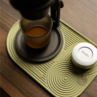 Outin Silicone Coffee Mat in green with geometric ridged surface