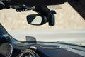 Nextbase Piqo 2K dash cam installed behind a rear-view mirror