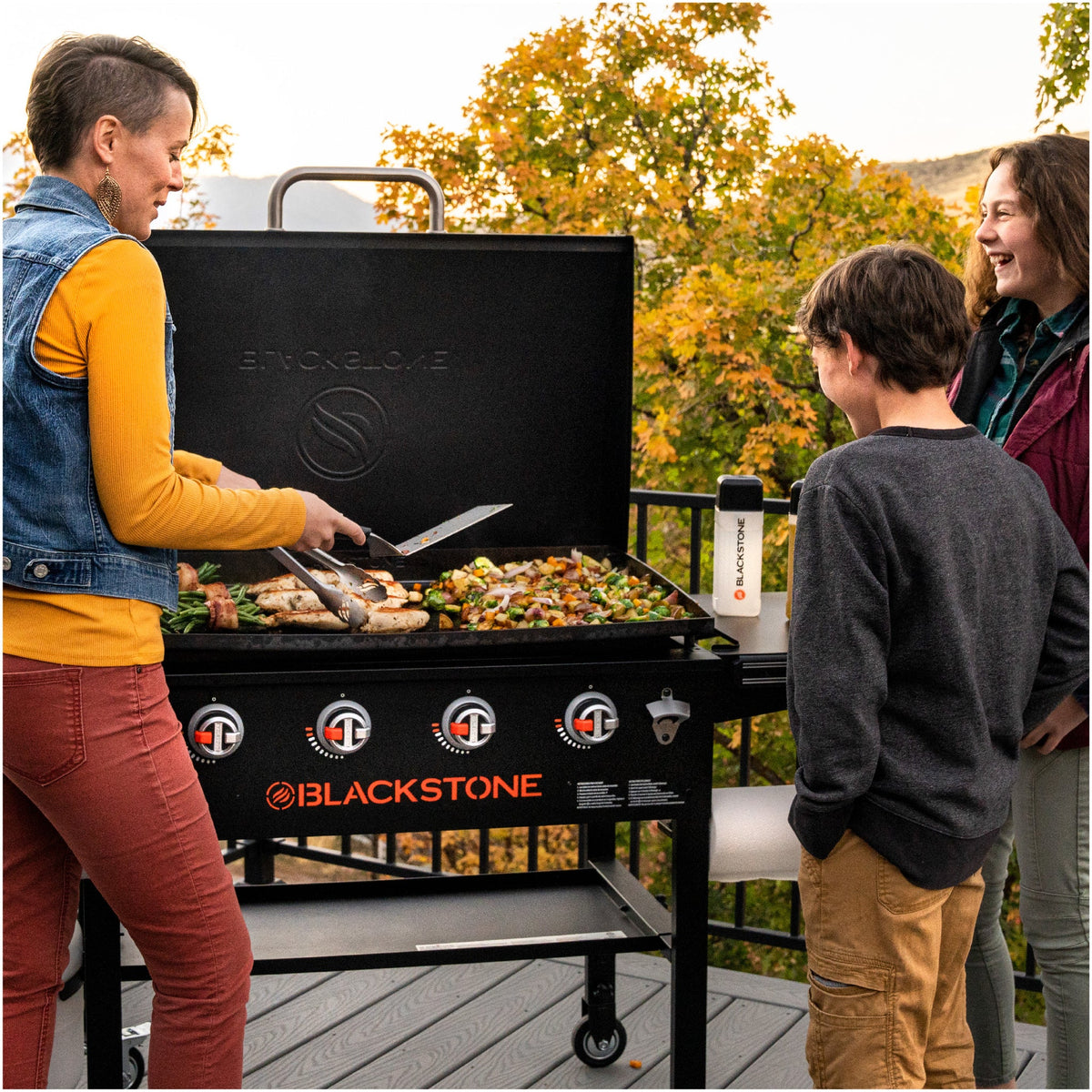 Blackstone Original 36" Griddle with Hood, 4 Burner Gas Griddle - Black - family at the griddle