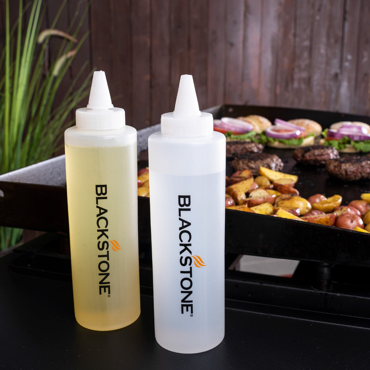 Blackstone 5 Piece Griddle Toolkit - squeeze bottles on the shelf
