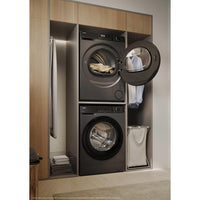 Haier X Series 5 9kg Heat Pump Tumble Dryer - Graphite - stacked laundry setup with door open