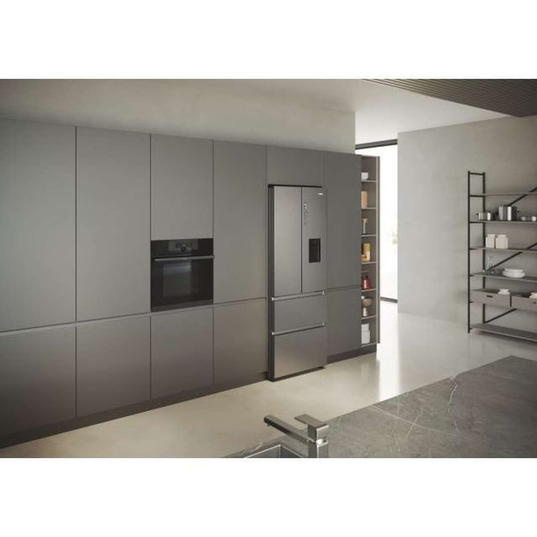 Haier HFR5719EWMP fridge freezer built into kitchen cabinets, side view