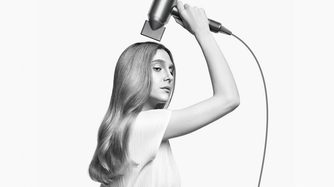 Dyson Supersonic Origin Hair Dryer - Prussian Blue/Rich Copper - Smoothing nozzle in use