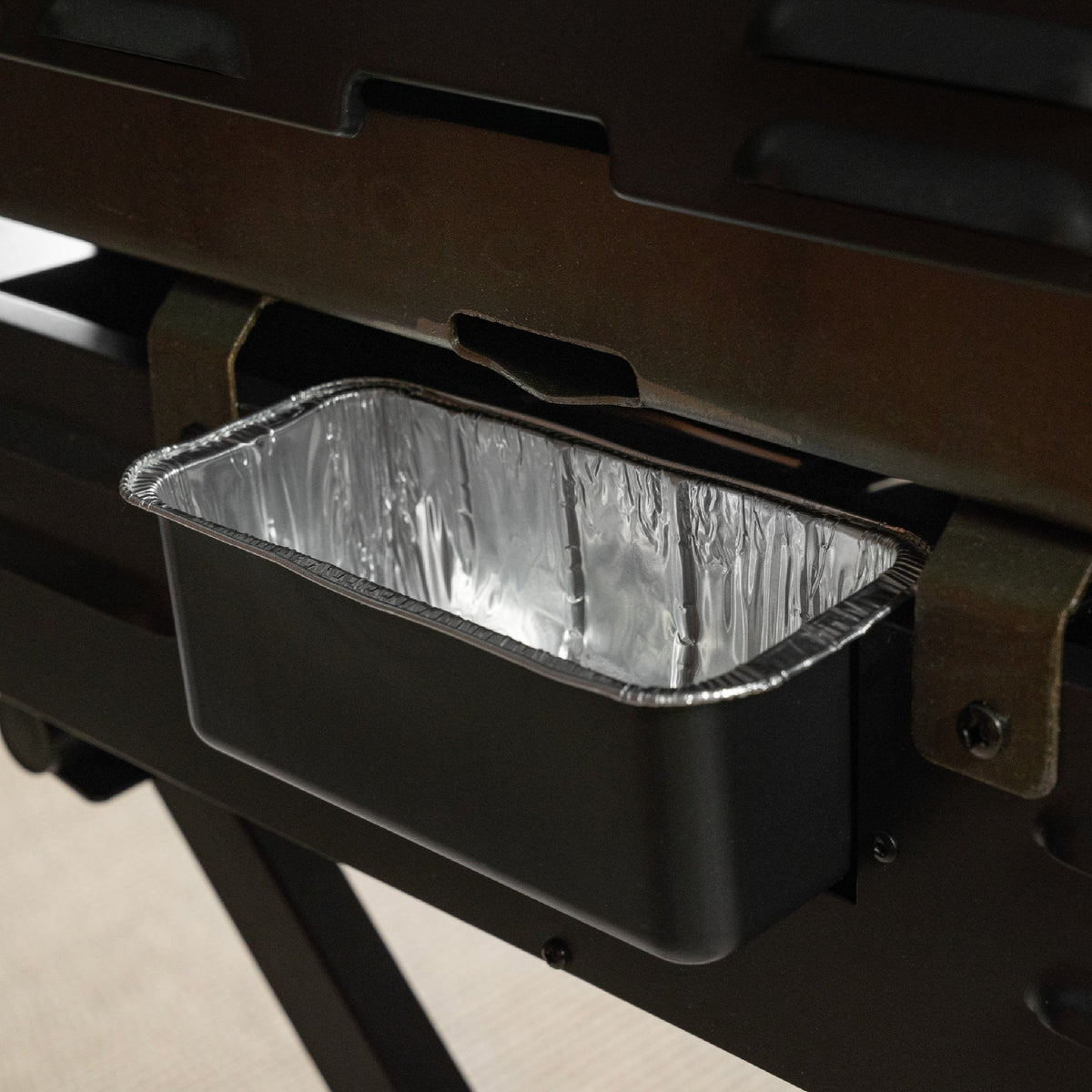 Blackstone On The Go 22" Omnivore Gas Griddle with Hood and Flexfold Legs - Black - rear grease cup
