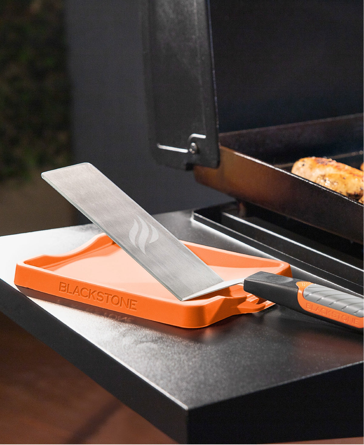 Blackstone Silicone Spatula Mat - Orange - mat on the griddle shelf