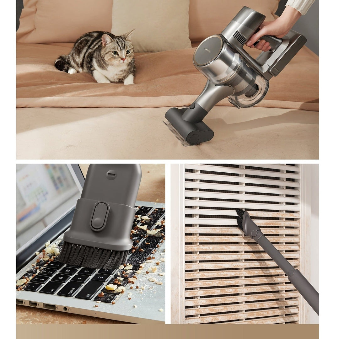 Dreame R20 VTV97A handheld unit cleaning a sofa, keyboard and vent