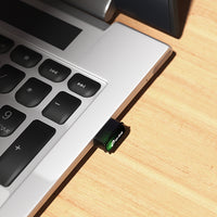 TP-Link Archer T3U Nano AC1300 Nano Dual Band Wi-Fi USB Adapter — in-use, plugged into laptop keyboard edge