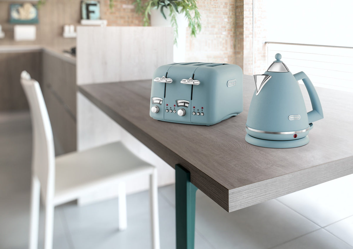 De'Longhi Argento Flora Kettle - Blue - on a kitchen table with the matching Argento Flora toaster