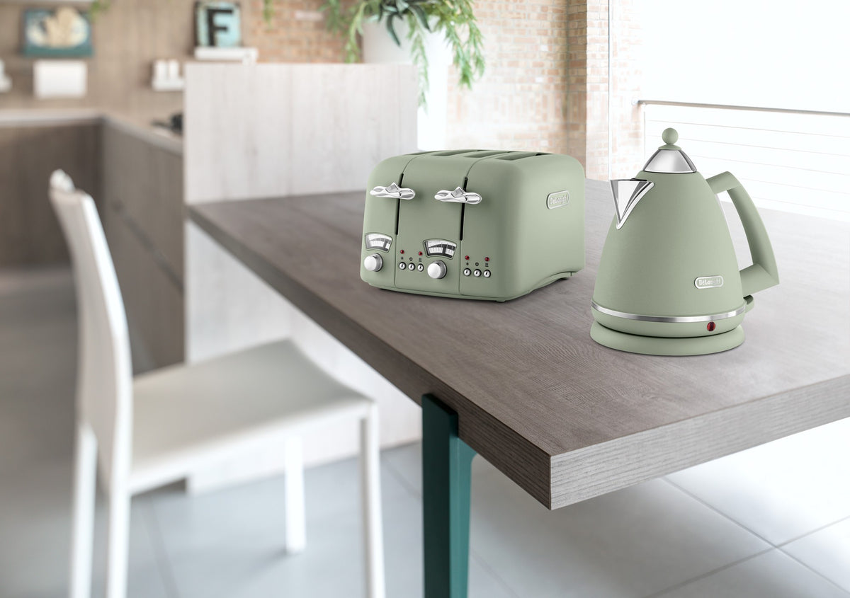 De'Longhi Argento Flora Kettle - Green - on a kitchen table with the matching Argento Flora toaster