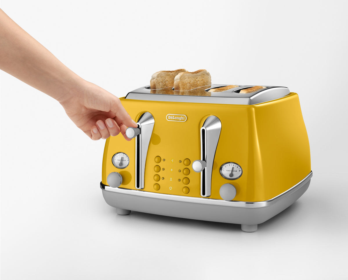 De'Longhi Icona Capitals 4 Slice Toaster - Yellow - browning control and lift lever in use