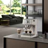 De'Longhi Stilosa Espresso Maker - Cream - on a kitchen counter with a view