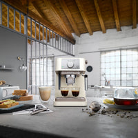 De'Longhi Stilosa Espresso Maker - Cream - in an open-plan kitchen with breakfast