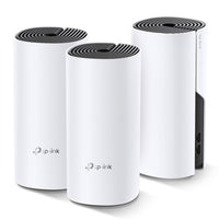 TP-Link Deco M4, three units — angled view showing one unit's port panel