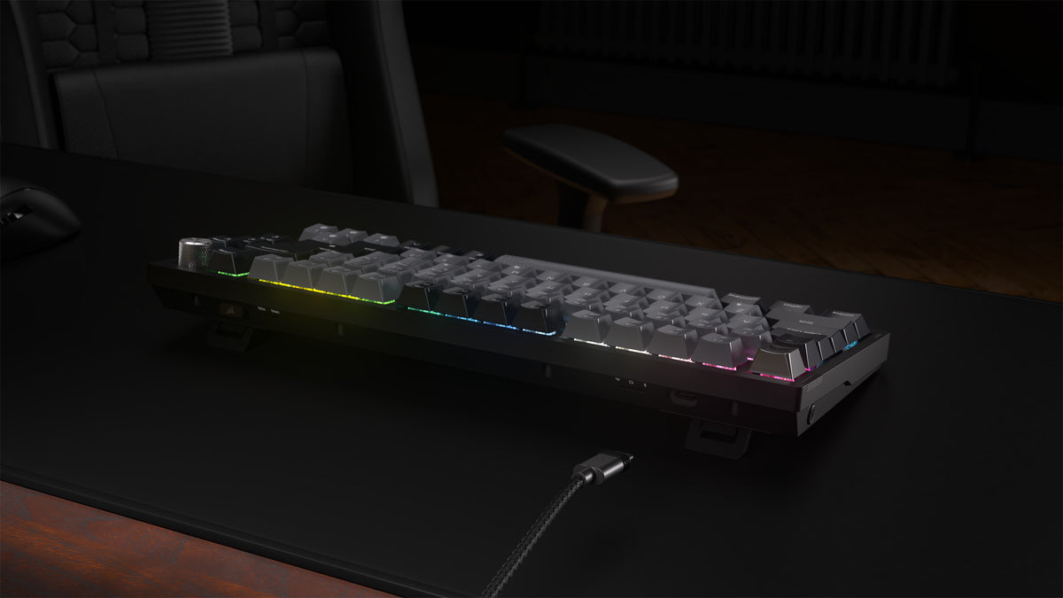 Corsair K65 Plus Wireless 75% RGB Mechanical Gaming Keyboard, UK Layout - Midnight Grey - angled view on the desk