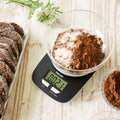 Beurer KS 25 Kitchen Scale in use, cocoa and flour being weighed in bowl