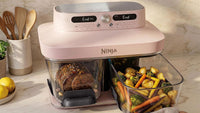 Ninja CRISPi DualZone Glass Air Fryer in Rose Quartz, lifestyle shot on kitchen counter