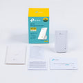 TP-Link RE200 AC750 Dual Band Wi-Fi Universal Wall-Plug Range Extender — box contents flat-lay (unit, box, quick-install guide)