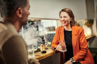 Sennheiser Conversation Clear Plus True Wireless Earphones — lifestyle, worn at a bar