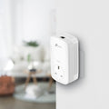 TP-Link TL-PA8010P KIT AV1300 Passthrough Powerline Kit — in-use, wall-mounted