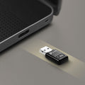 TP-Link TL-WN823N N300 Mini Wi-Fi USB Adapter, QSS button — in-use, plugged into laptop