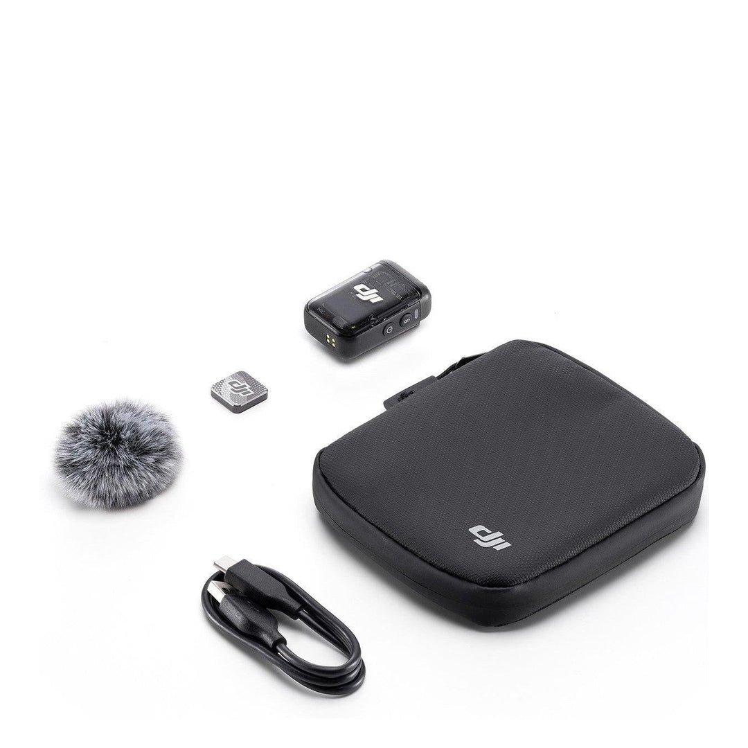DJI Mic 2 CP.RN.00000328.02 transmitter laid out with pouch, windscreen and charging cable