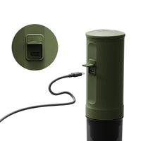 Outin Nano portable espresso machine in Forest Green with ground coffee, coffee capsules and a glass of espresso