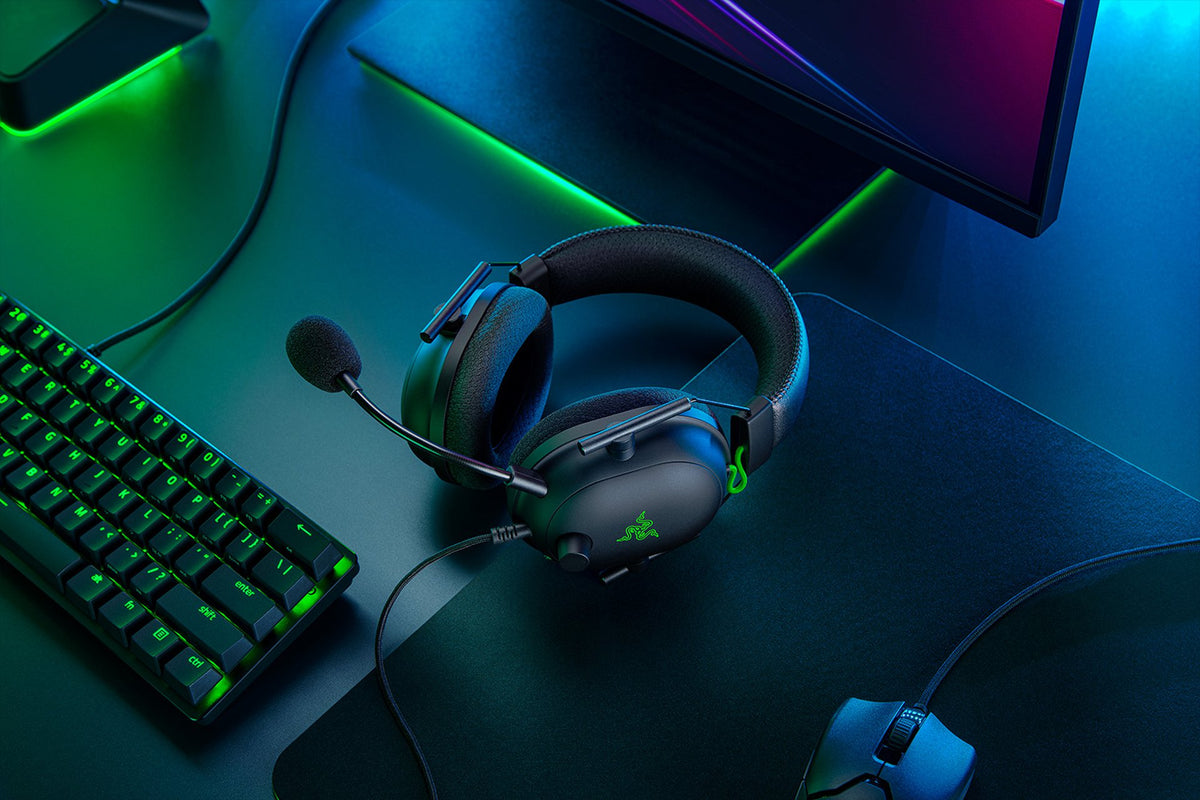 Razer BlackShark V2 Wired Esports Headset with USB Sound Card - Black - on a gaming desk