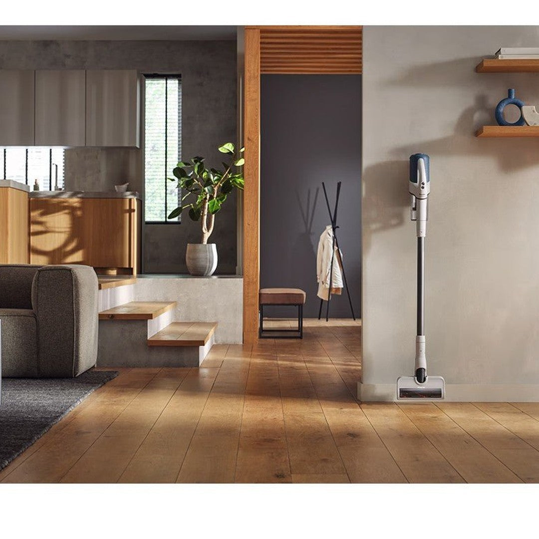 Miele Duoflex HX1 12377910 stick vacuum standing in a living room
