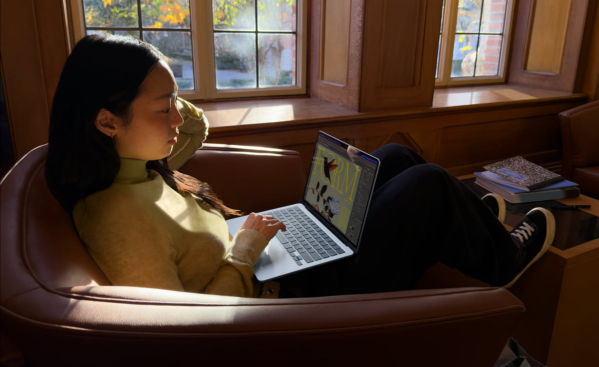 Apple MacBook Air 13" M5 16GB/512GB Laptop - Silver - silver MacBook Air in use on an armchair