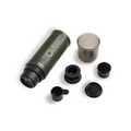 Outin Nano portable espresso machine in Forest Green with ground coffee, coffee capsules and a glass of espresso