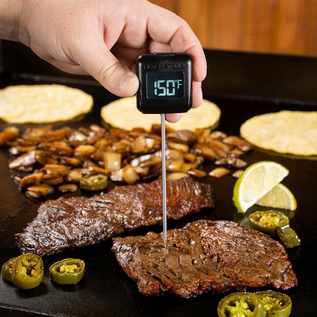 Blackstone Digital Probe Thermometer - checking a steak on the griddle
