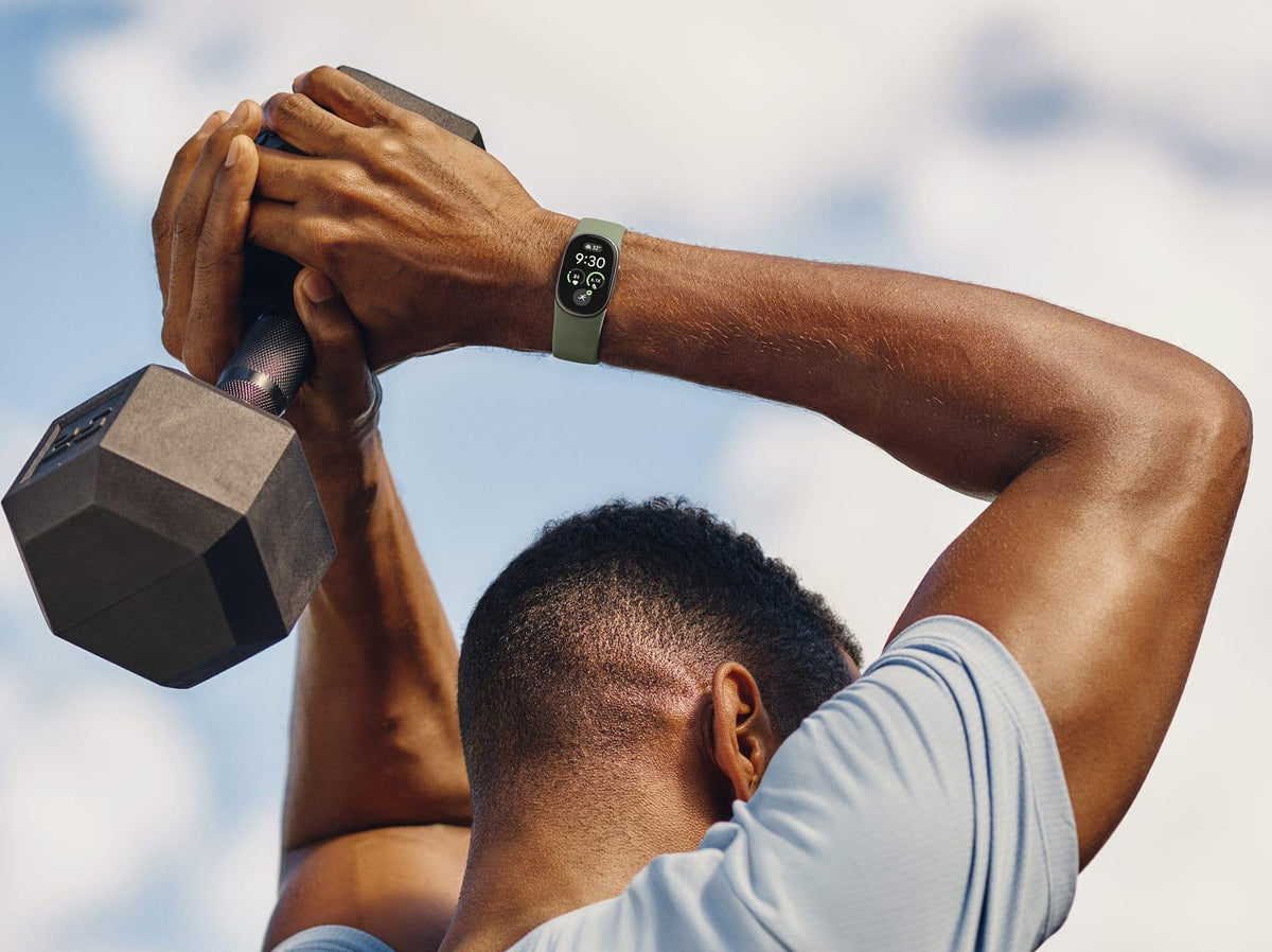 Google Fitbit Edge Smartwatch - Olive Pyrite - in use