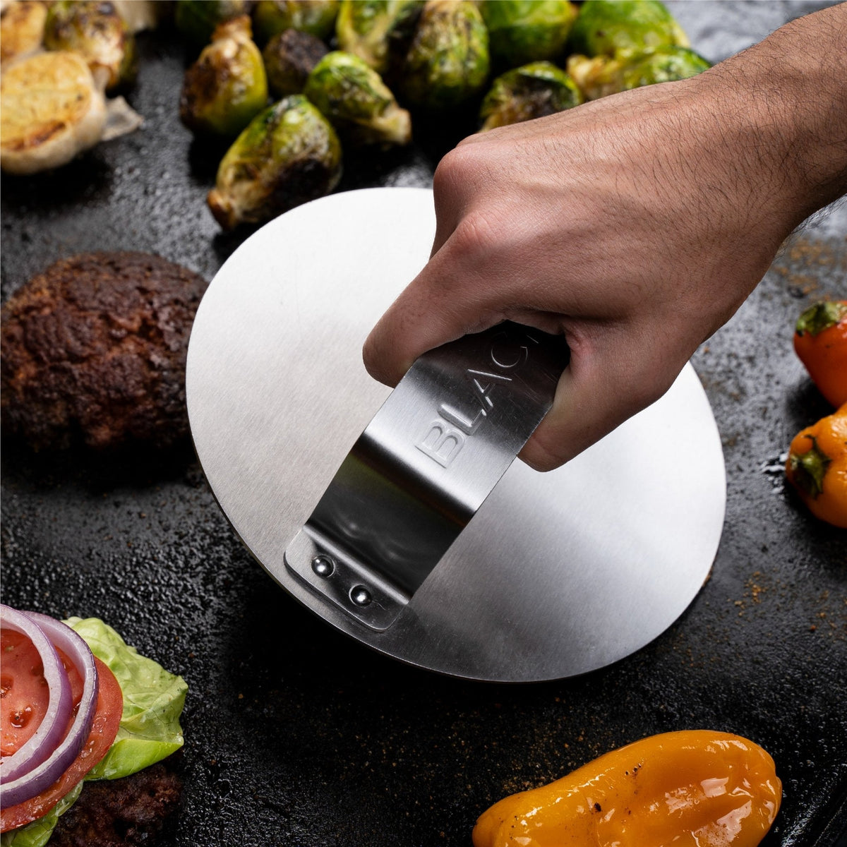 Blackstone 3 Piece Hamburger Kit - burger press in use