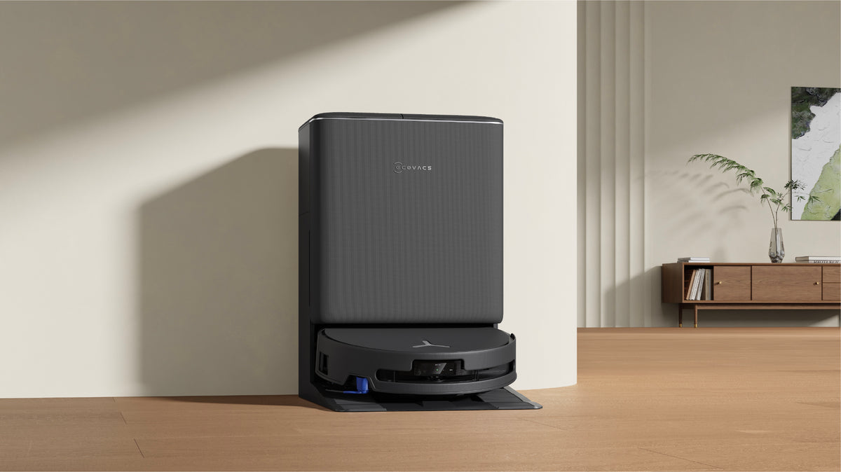 Ecovacs DEEBOT T90 PRO OMNI Robot Vacuum and Mop - Black - OMNI station in a living room