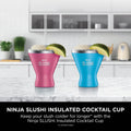 Two Ninja SLUSHi Pink and Bright Blue insulated cocktail cups on a kitchen counter, lifestyle shot