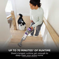 Shark PowerDetect Cordless Vacuum Cleaner in use on a staircase, captioned 'Up to 70 minutes of runtime'