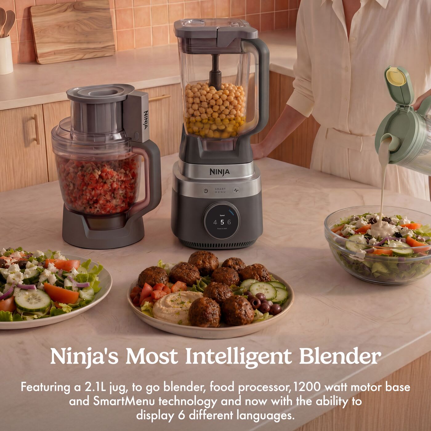 Ninja CrushBOSS 3-in-1 Kitchen System in Onyx, white background, all three vessels filled with food