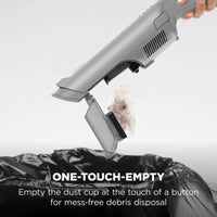 Shark WandVac Deluxe Pet Pro One-Touch-Empty dust cup releasing debris into a bin