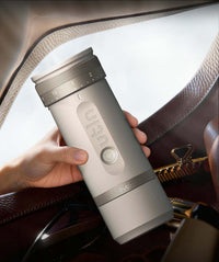 Outin Fino portable electric coffee grinder in Sandstone White