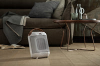 De'Longhi Capsule 1800W Fan Heater - White - in a living room
