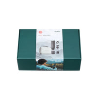 Outin Nano Forest Green portable espresso machine beside its Nano Protective Case with capsule storage