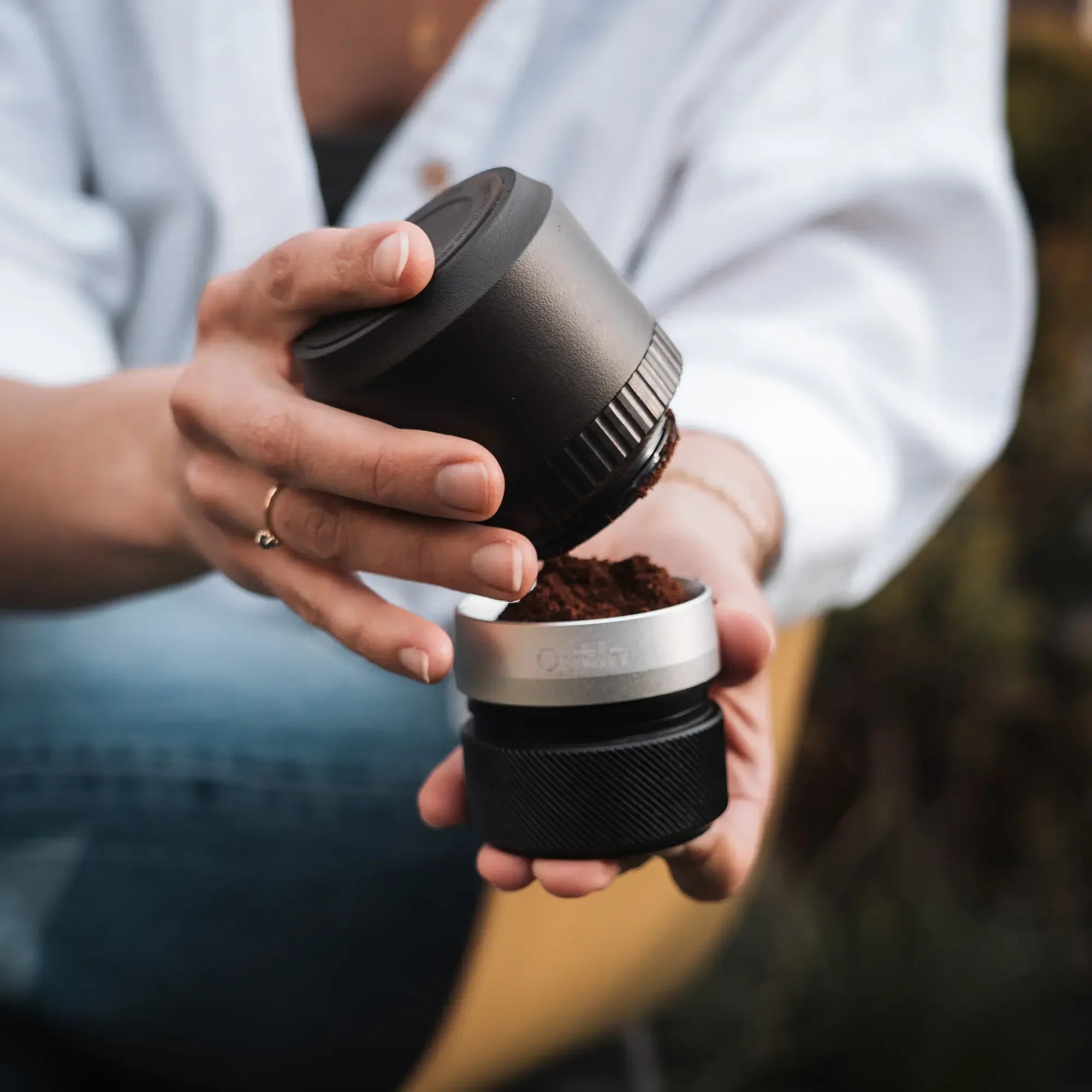 Outin Fino portable electric coffee grinder in Sandstone White