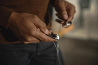 Sennheiser IE 900 Audiophile Earphones — lifestyle, held in hand