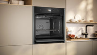 NEFF B64FS31G0B N90 Slide&Hide single oven with steam function in Graphite-Grey
