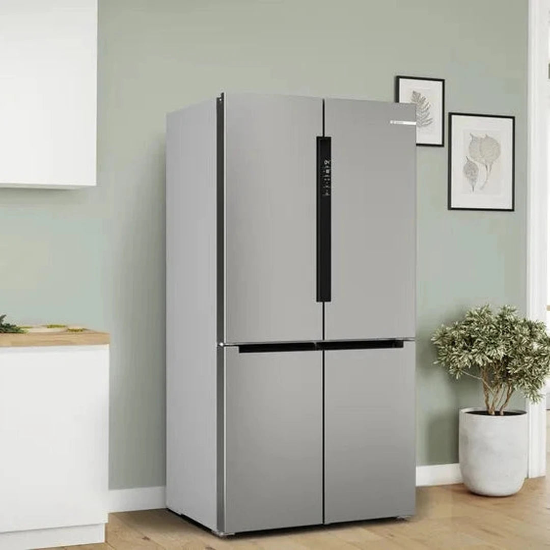 Bosch XXL KFN96VPEAG 4 door fridge freezer in a kitchen, doors closed