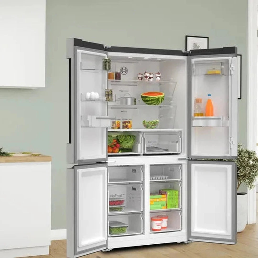 Bosch XXL KFN96VPEAG 4 door fridge freezer in a kitchen, doors open