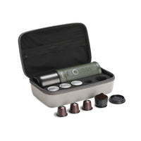 Outin Nano Forest Green portable espresso machine beside its Nano Protective Case with capsule storage
